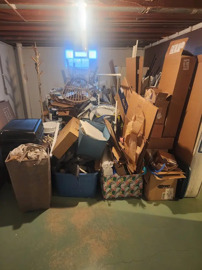 Roll-off dumpster container at job site for Construction Dumpster Rental in Salford